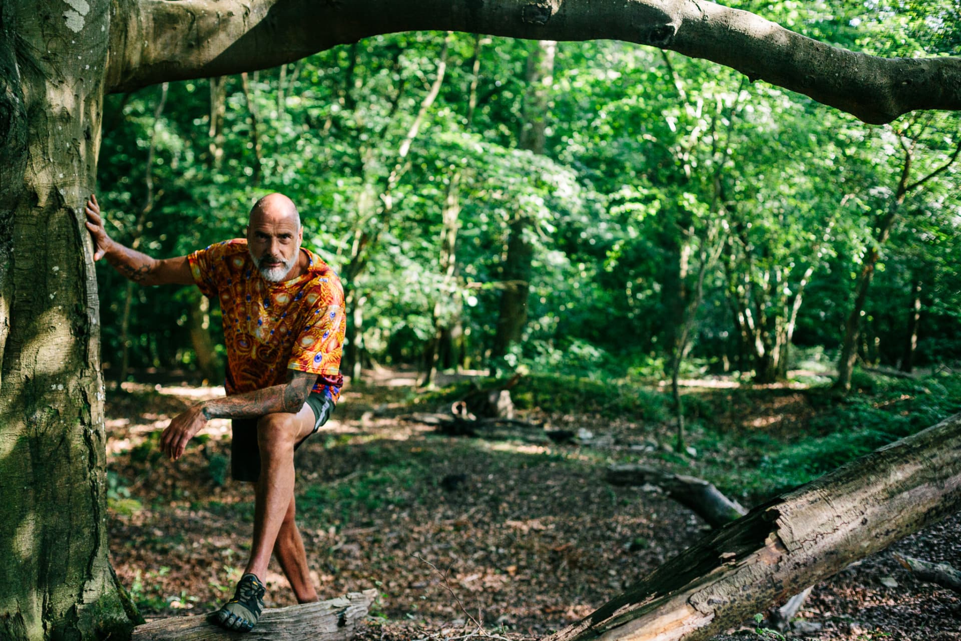 Christopher Gladwell resting against a beech tree in woodland